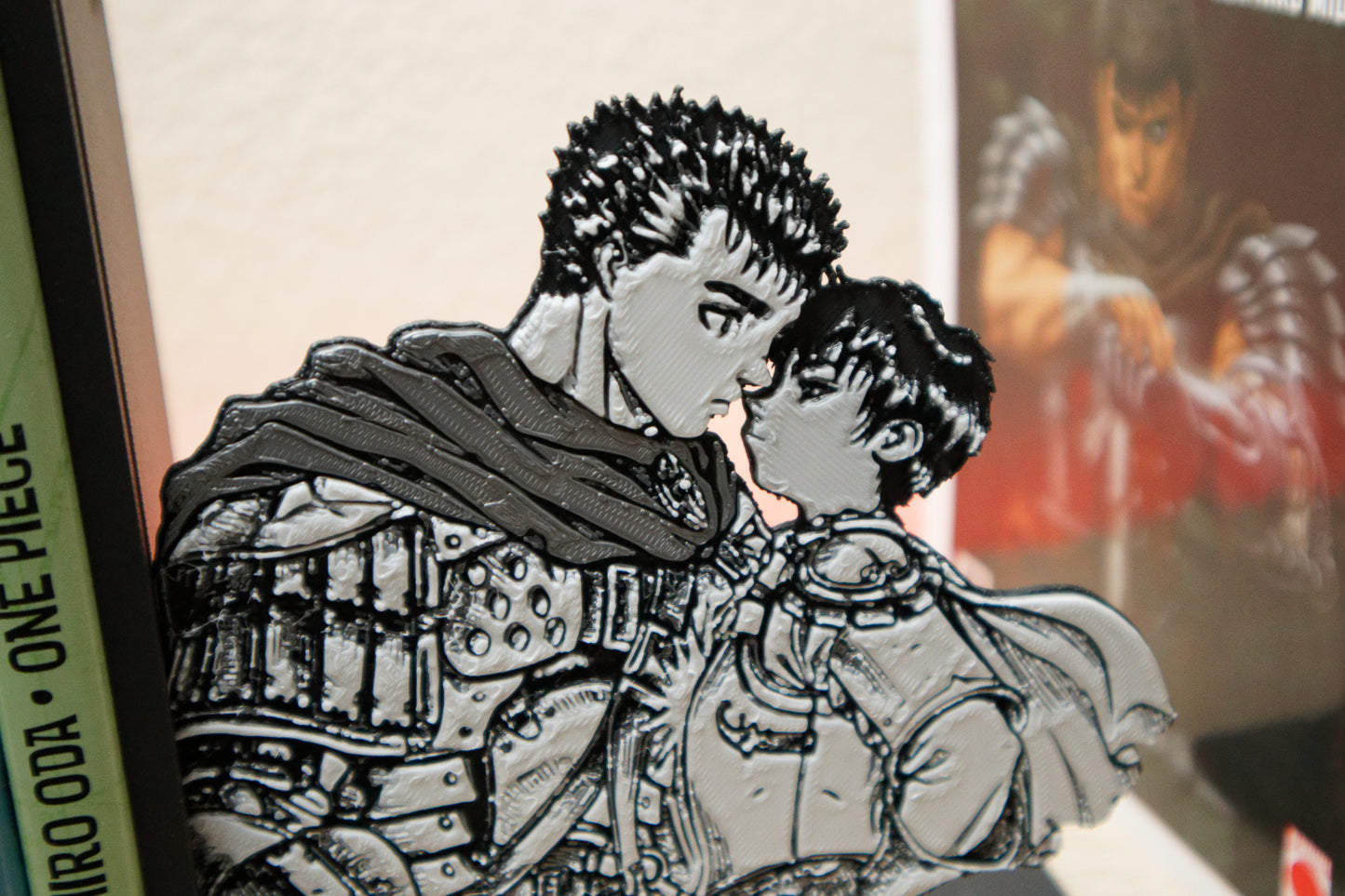 Sujetalibros de Guts y Casca